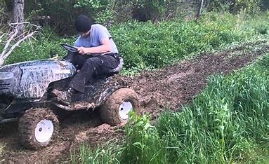 Lawn Mower In The Spring Mud