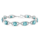 .925 Sterling Silver 7x7 mm Cushion Cut Blue Topaz and 1/20 cttw Round Cut Diamond Fashion Tennis Bracelet (I-J Color, I1-I2 Clarity) - 7"-1