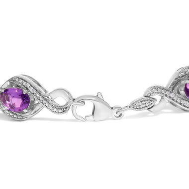 .925 Sterling Silver 1/10 Cttw Natural Round Diamond and 7X5MM Oval Amethyst Cross Tennis Bracelet (I-J Color, I1-I2 Clarity) - 7" - 0