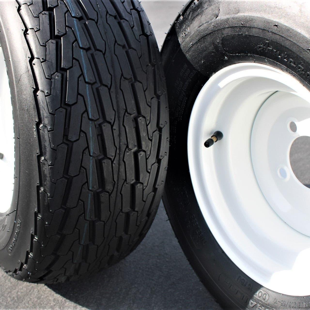 (Set of 2) 205/65-10 20.5x8.0-10 10 ply Load Range E super durable Antego Trailer Tire Wheel Assy - 4 Lug White Rim.